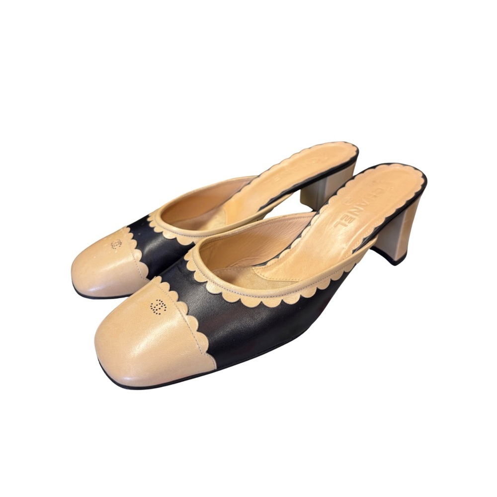 CHANEL Two-Tone Scalloped Leather Mules in Beige and Black